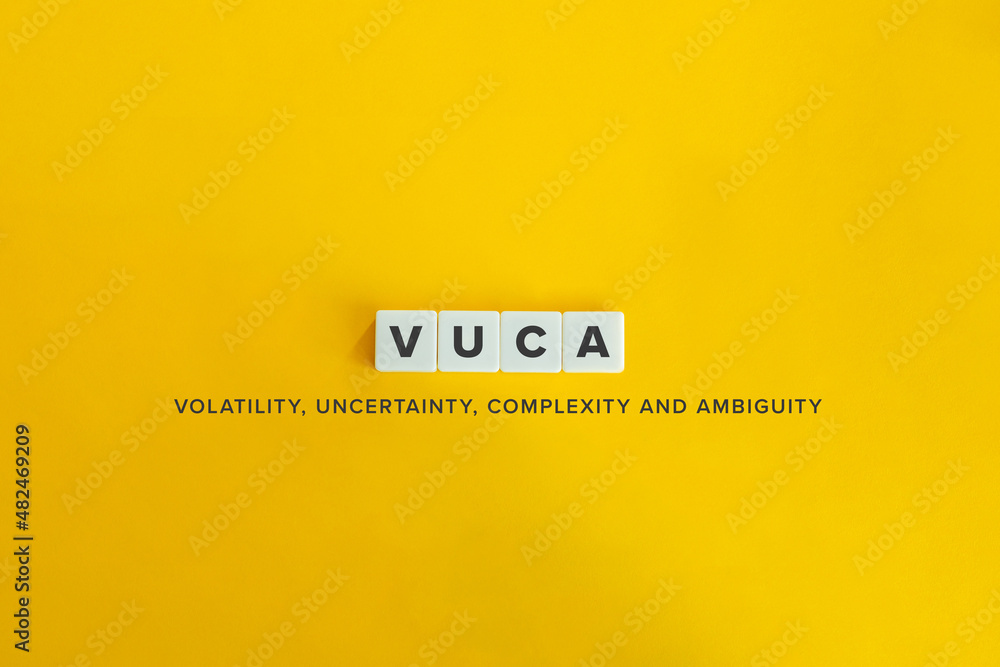 Volatility, Uncertainty, Complexity and Ambiguity (VUCA) banner. Letter tiles on bright orange background. Minimal aesthetics. Volatility, Uncertainty, Complexity and Ambiguity (VUCA) banner. Letter tiles on bright orange background. Minimal aesthetics.