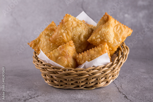 Traditional pastry called pastel  in Brazil. Brazilian snack. Brazilian pastry
