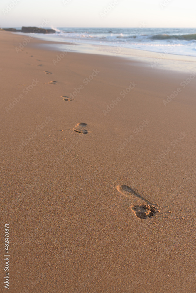 Footprints in the sand on the beach at sunset, Cape Trafalgar, Canos de Meca, Cadiz, Andalusia, Spain Footprints in the sand on the beach at sunset, Cape Trafalgar, Canos de Meca, Cadiz, Andalusia, Spain