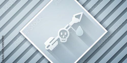 Paper cut Poison on the arrow icon isolated on grey background. Poisoned arrow. Paper art style. Vector