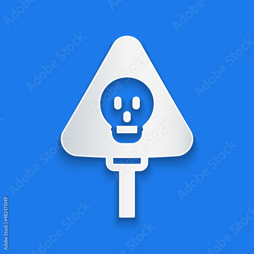 Paper cut Bones and skull as a sign of toxicity warning icon isolated on blue background. Paper art style. Vector