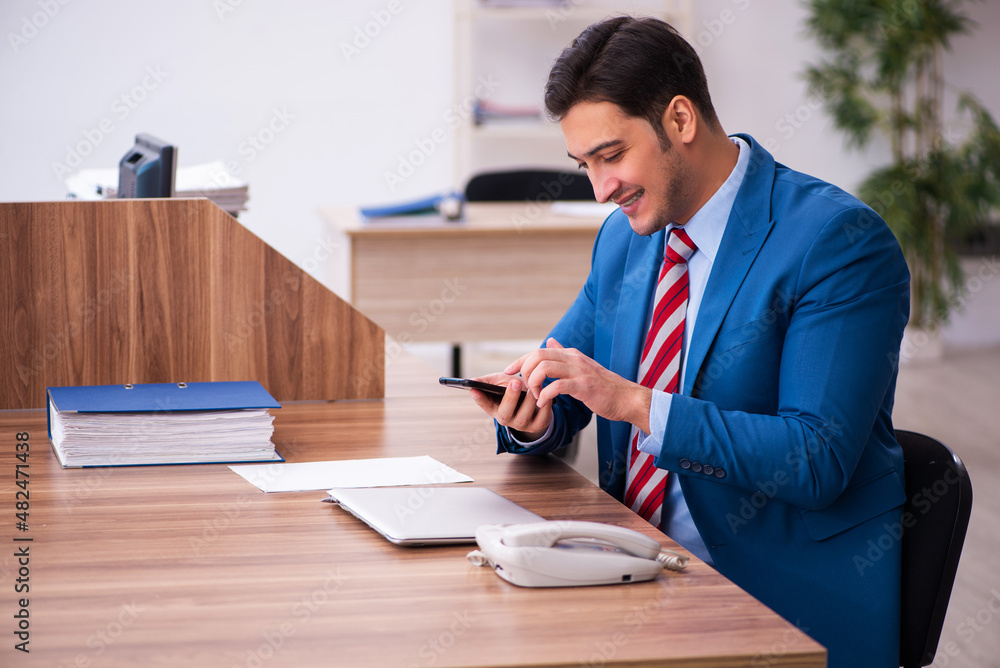 Young businessman employee working in the office Young businessman employee working in the office
