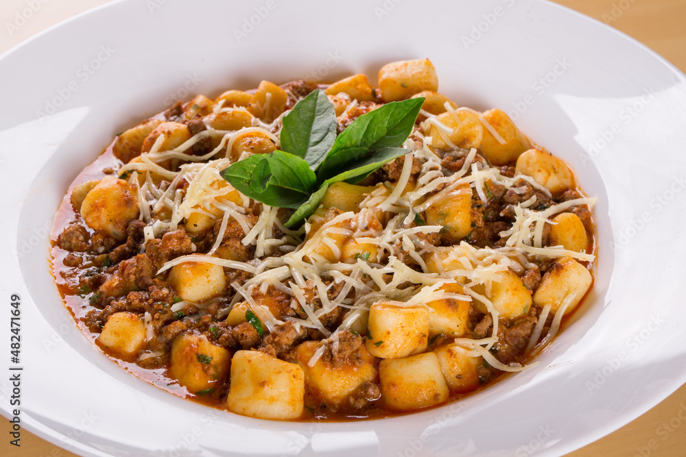 italian potato gnocchi with bolognese sauce. close up italian potato gnocchi with bolognese sauce. close up
