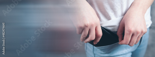 woman puts wallet in her pocket