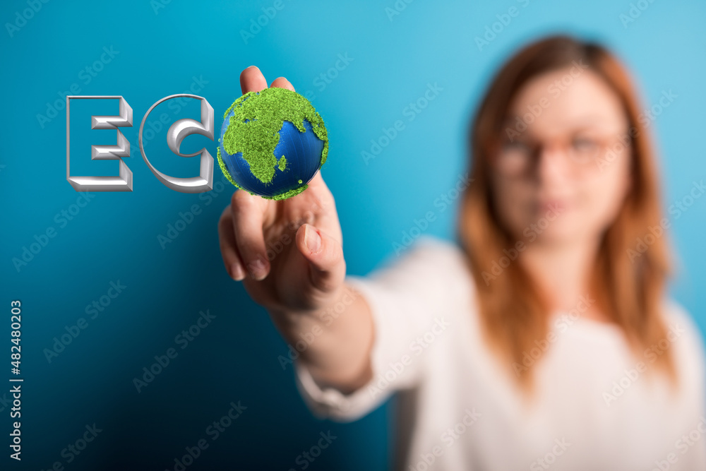 Eco word on the background of green leaves of carrots. plantation Eco word on the background of green leaves of carrots. plantation