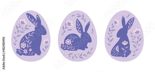 Happy Easter. Easter bunnies in eggs are decorated flowers. Hares are sitting, a set of illustrations in a flat style, very peri color.