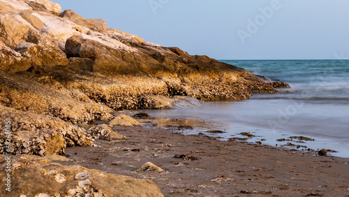Fototapeta Naklejka Na Ścianę i Meble -  rocky coast of the adriatic sea in summer in Cavallino, Italy