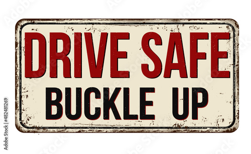 Drive safe buckle up vintage rusty metal sign photo