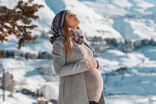 Happy Pregnant Woman Enjoying Winter