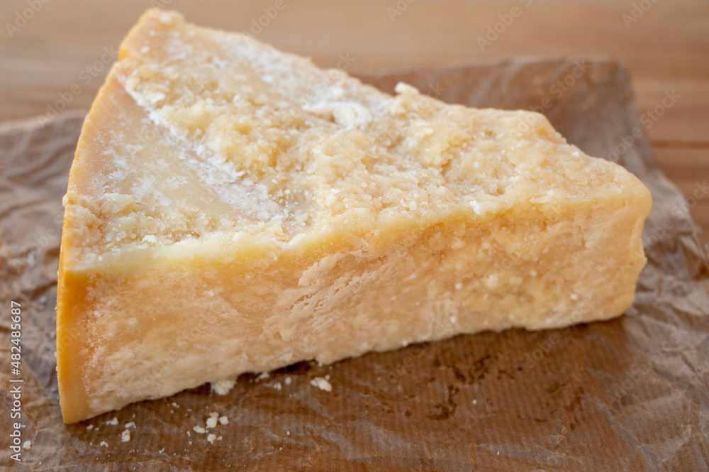 Cheese collection, piece of matured cow cheese pasmesan parmigiano reggiano made from cow milk Cheese collection, piece of matured cow cheese pasmesan parmigiano reggiano made from cow milk