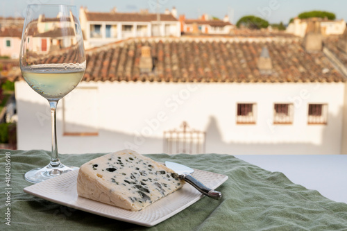 Cheese collection, semi-hard French blue cheese roquefort from Roquefort-sur-Soulzon, France served with sweet cold white french wine