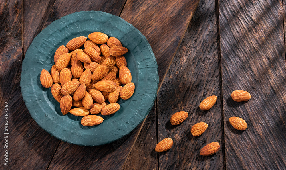 Prunus dulcis - Organic peeled almonds in the bowl Prunus dulcis - Organic peeled almonds in the bowl