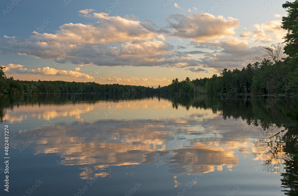 Fototapeta premium Evening Clouds on a Serene Wilderness Lake