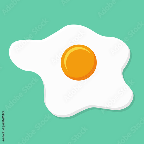 Fried egg or scrambled eggs isolated on green menthol background
