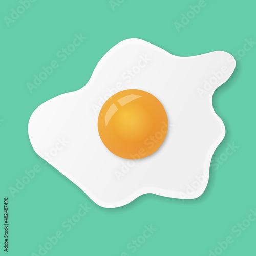 Fried egg or scrambled eggs isolated on green menthol background