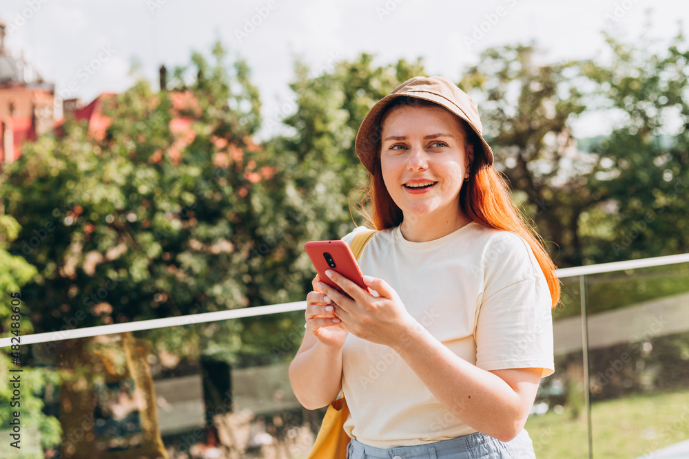 Portrait of positive cheerful girl use smart phone share social media news wear style stylish trendy hat over nature background, Summer time Portrait of positive cheerful girl use smart phone share social media news wear style stylish trendy hat over nature background, Summer time