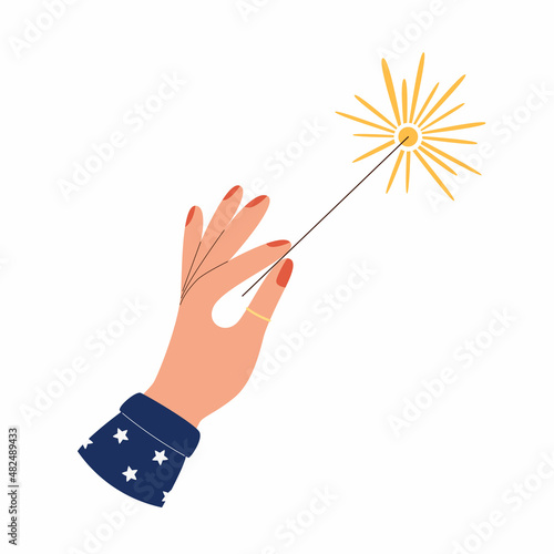 Hand holding burning sparkler fireworks