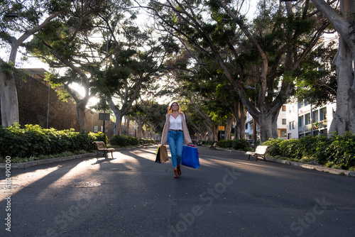 woman carrying shopping paper bags © Ivan