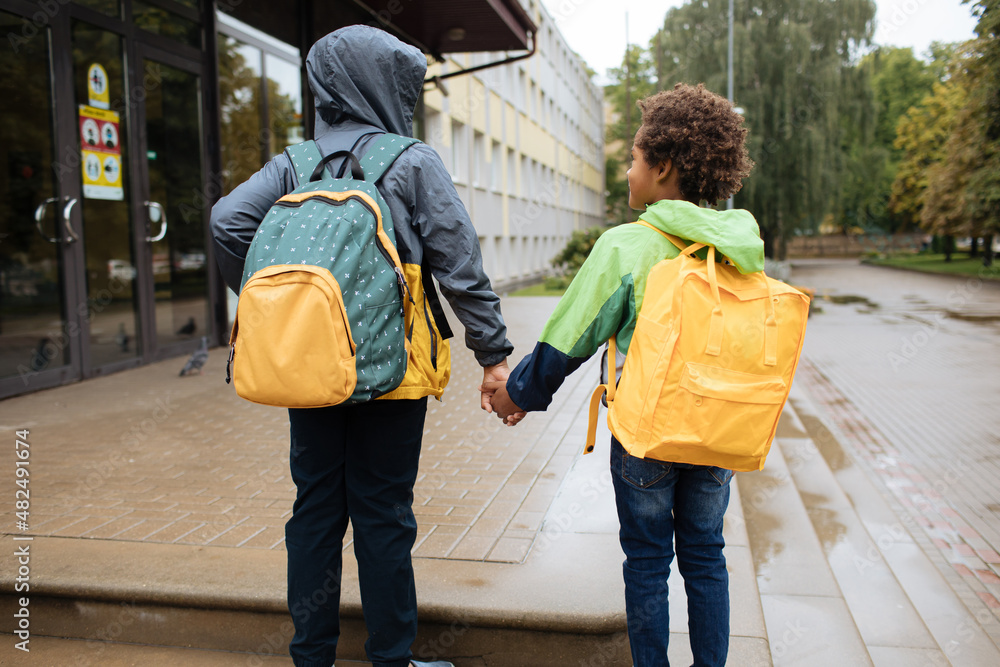 Schoolboys with backpacks. Two African American boys next to the
