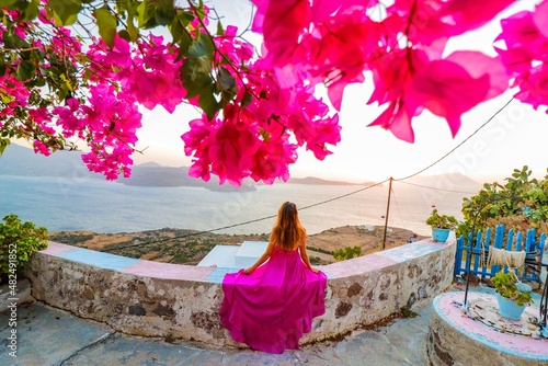 girl in the garden of sunset from the beach in milos greece 