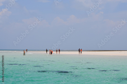 tourists after snorkeling on the shore of the Indian ocean