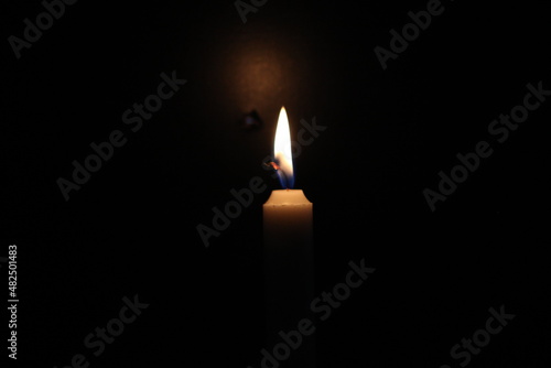 Up-close View Of A Candle Flame With Dark Background. 
