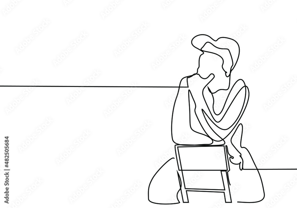 The man sitting on the chair from behind puts his hand on his chin and is deep in thought.