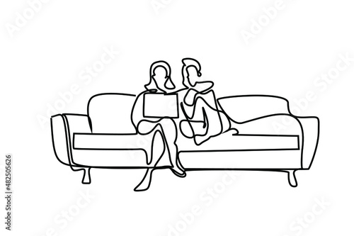 husband and wife watching movies and videos on laptop together on the same sofa