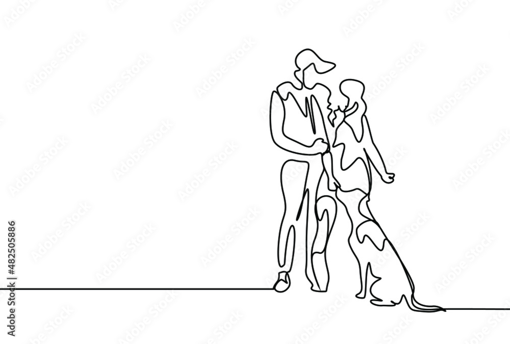 Fototapeta premium couple in love having fun with their dog outside
