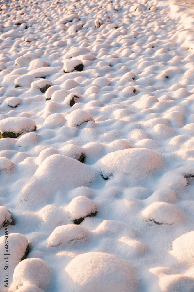 Obraz premium Snow covered rocks texture, bumpy soft snow texture