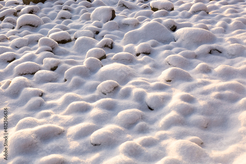 Snow covered rocks texture, bumpy soft snow texture