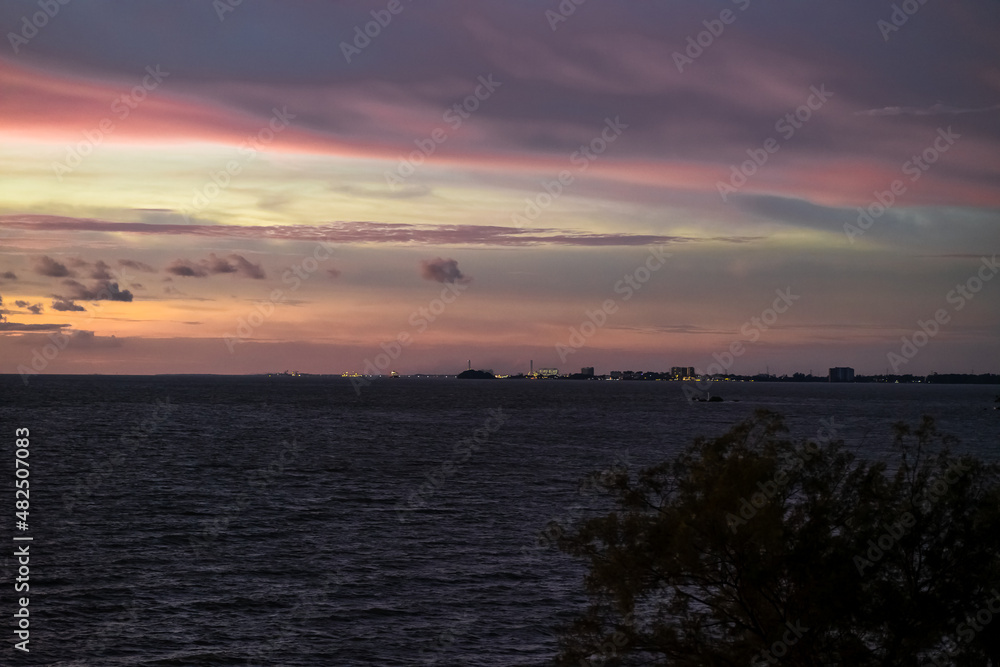 Dramatic clouds and sunset sky over the sea with colourful clouds in Port Dickson, Malaysia.