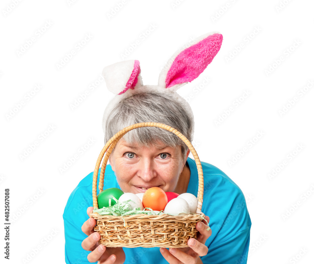 Senior woman with basket with Easter eggs Isolated Senior woman with basket with Easter eggs Isolated