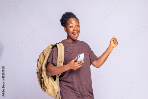 An Black African woman is shocked after learning about an online summer sale.