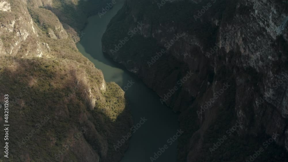 Aerial tilt up shot of scenic curvy Grijalva River In Sumidero Canyon during sunny day,Mexico Aerial tilt up shot of scenic curvy Grijalva River In Sumidero Canyon during sunny day,Mexico