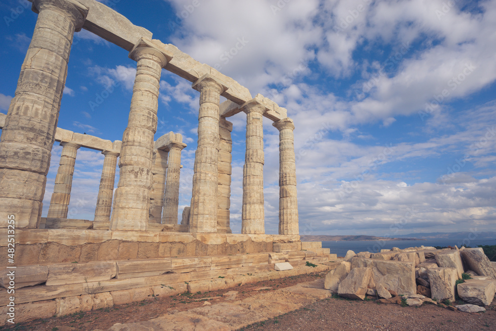 Temple of Poseidon with blue sky and clouds, Sounion, Greece
