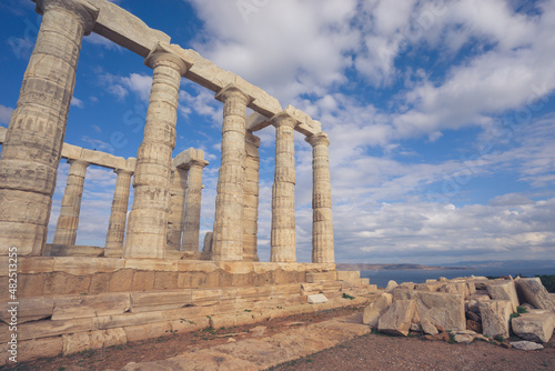 Temple of Poseidon with blue sky and clouds, Sounion, Greece