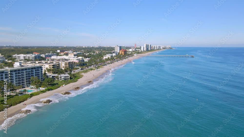 Aerial drone shot of City with Beach and Ocean in Deerfield Beach. Clear blue sky with empty space Aerial drone shot of City with Beach and Ocean in Deerfield Beach. Clear blue sky with empty space
