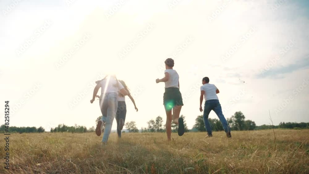 happy family children kids together run in park at sunset silhouette. people in park concept mom a dad daughter and son joyful run. lifestyle parents and little baby child fun summer vacation running happy family children kids together run in park at sunset silhouette. people in park concept mom a dad daughter and son joyful run. lifestyle parents and little baby child fun summer vacation running