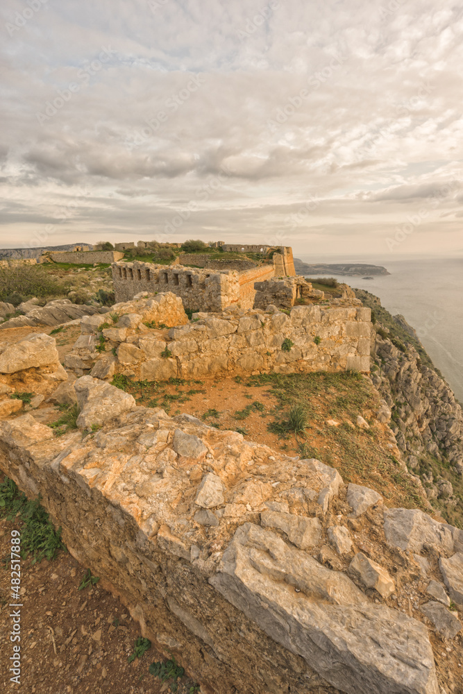 Portrait view of old Palamidi fortress on the cliff, with view of the Argolic Gulf, Greece