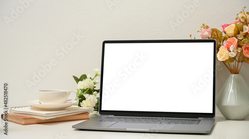 Fototapeta Close-up, a women's office desk with modern laptop computer