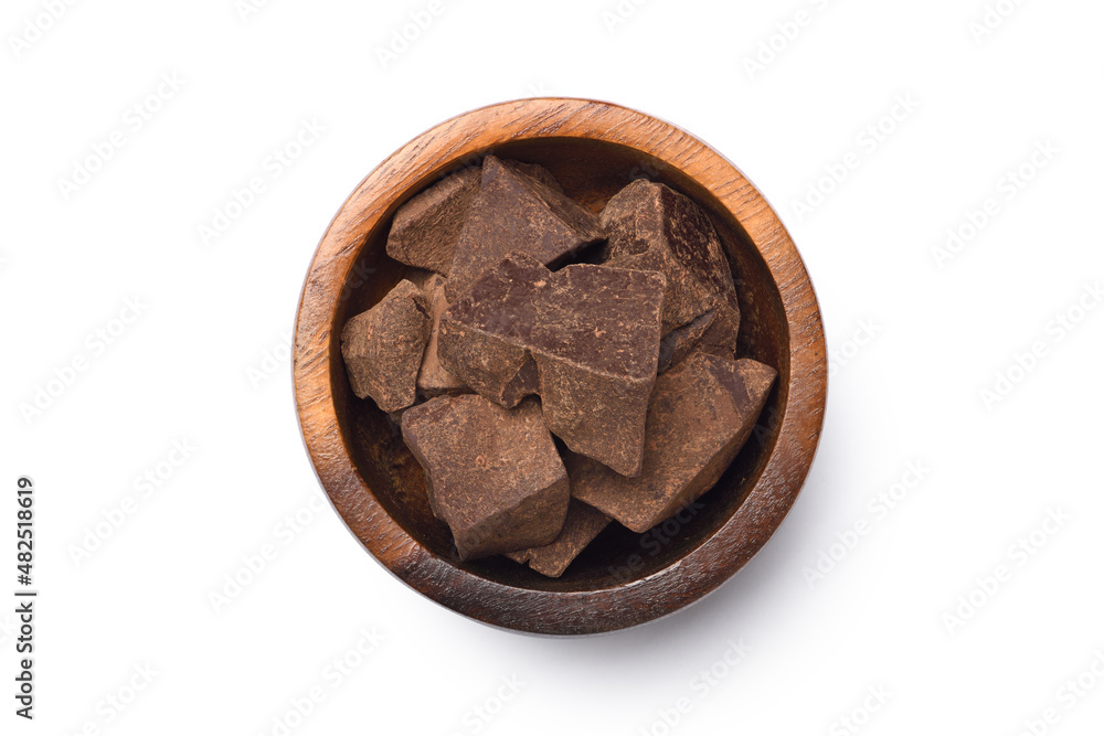 Flat lay of Cocoa mass in wooden bowl isolated on white background. Clipping path. Flat lay of Cocoa mass in wooden bowl isolated on white background. Clipping path.