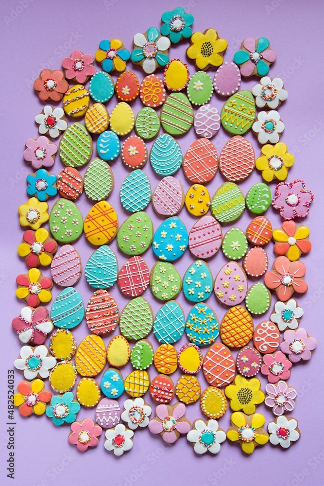 Happy Easter background. Multicolored pastel easter eggs cookies. Easter greeting card with colorful gingerbread.Mock up. Banner. Top view. Happy Easter background. Multicolored pastel easter eggs cookies. Easter greeting card with colorful gingerbread.Mock up. Banner. Top view.