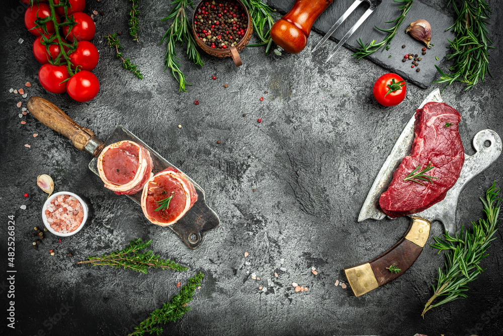 Variety of raw black angus prime meat steaks beef rump steak, Tenderloin fillet mignon for grilling on old meat cleaver on dark background. banner, menu recipe top view Variety of raw black angus prime meat steaks beef rump steak, Tenderloin fillet mignon for grilling on old meat cleaver on dark background. banner, menu recipe top view