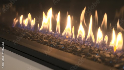 Close Up of a Modern Electric Fireplace with Flames and Rocks photo