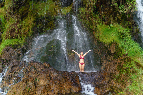 Fotografija Full view of caucasian woman in swimsuit at thermal springs in Colombia
