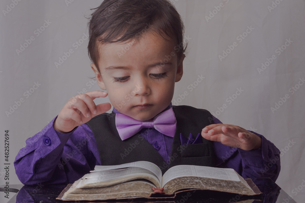 portrait of little man reading the word of God