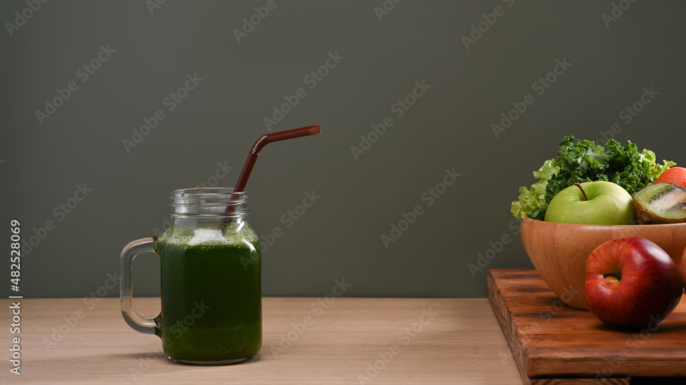 Fresh green detox vegetable juice with ingredients on wooden table. Healthy drinks concept. Fresh green detox vegetable juice with ingredients on wooden table. Healthy drinks concept.
