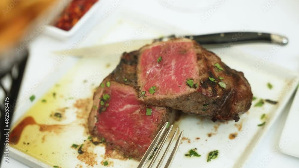 Beautiful new York strip steak with French fries slow motion 4k 30p Beautiful new York strip steak with French fries slow motion 4k 30p