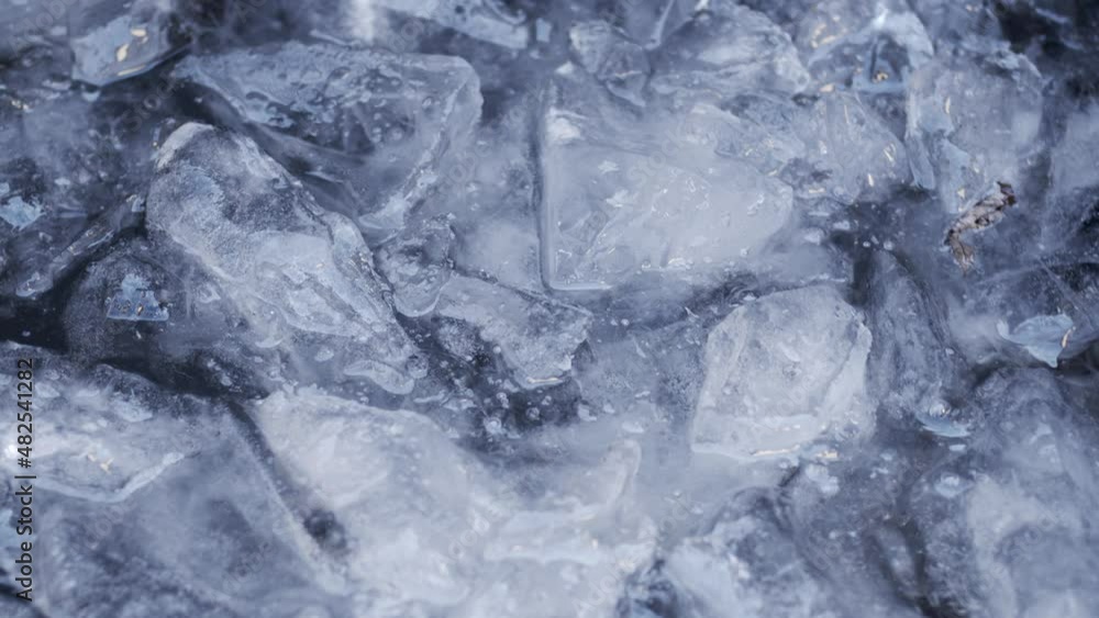 Cold ice water moving in a lake with ice chunks floating Cold ice water moving in a lake with ice chunks floating